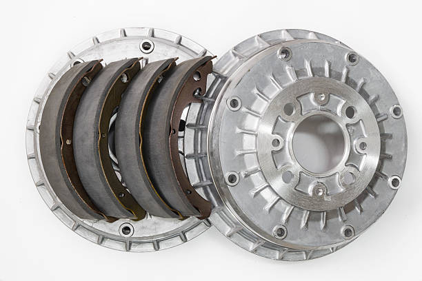 Brake shoes and drums on a white background